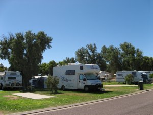 Shady grassed caravan and camping sites at Arno Bay.